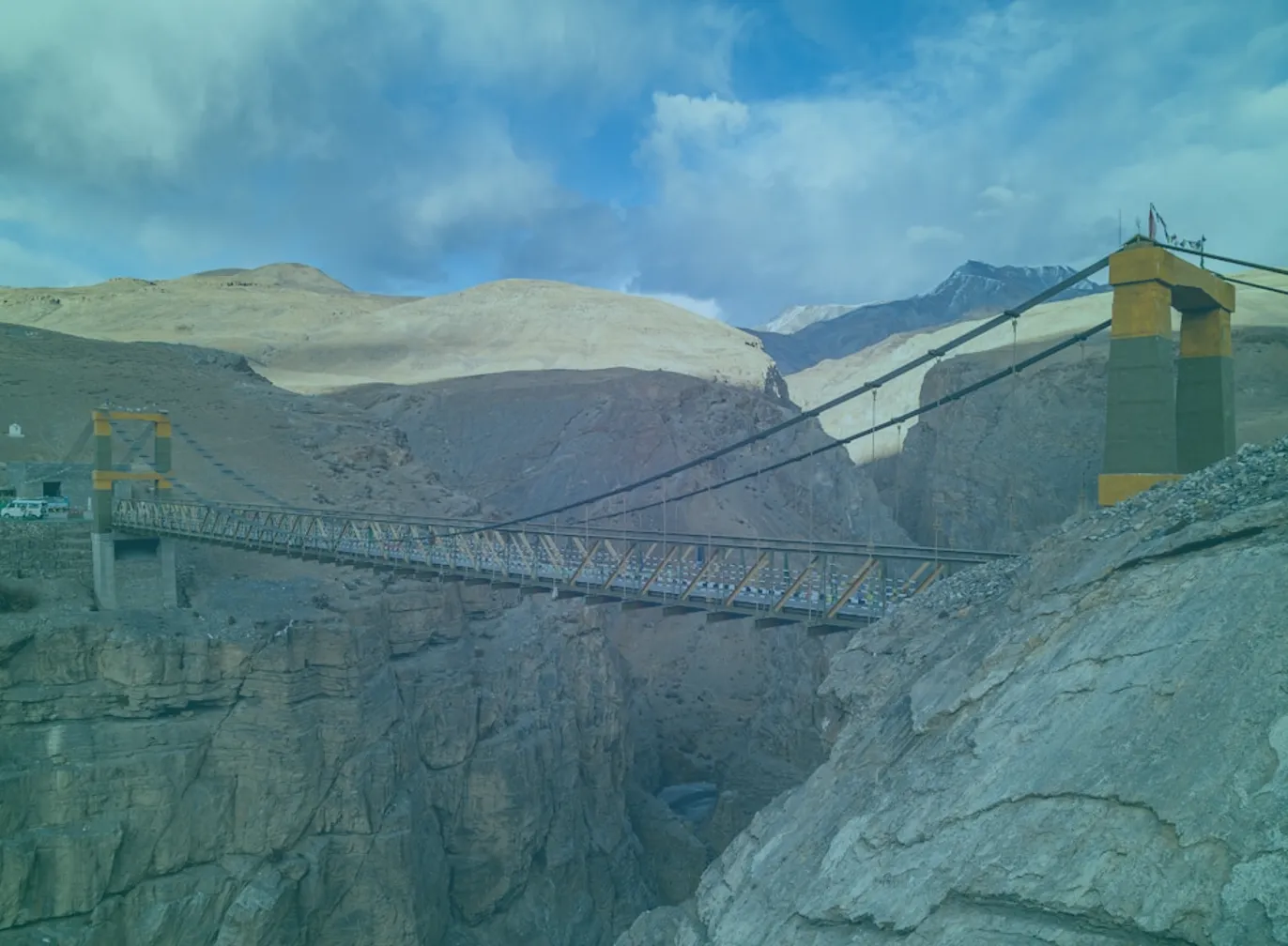 Cable-stayed bridge over calm water — connecting strategy to growth