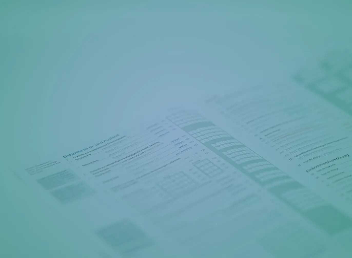 Financial documents and a calculator on a desk, representing the paperwork behind selling a manufacturing business